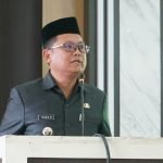 Bupati Gorut, Thariq Modanggu, saat memberikan keterangan tambahan dalam Rapat Paripurna LKPJ Bupati Gorontalo Utara Tahun 2022. (Foto: Istimewa)
